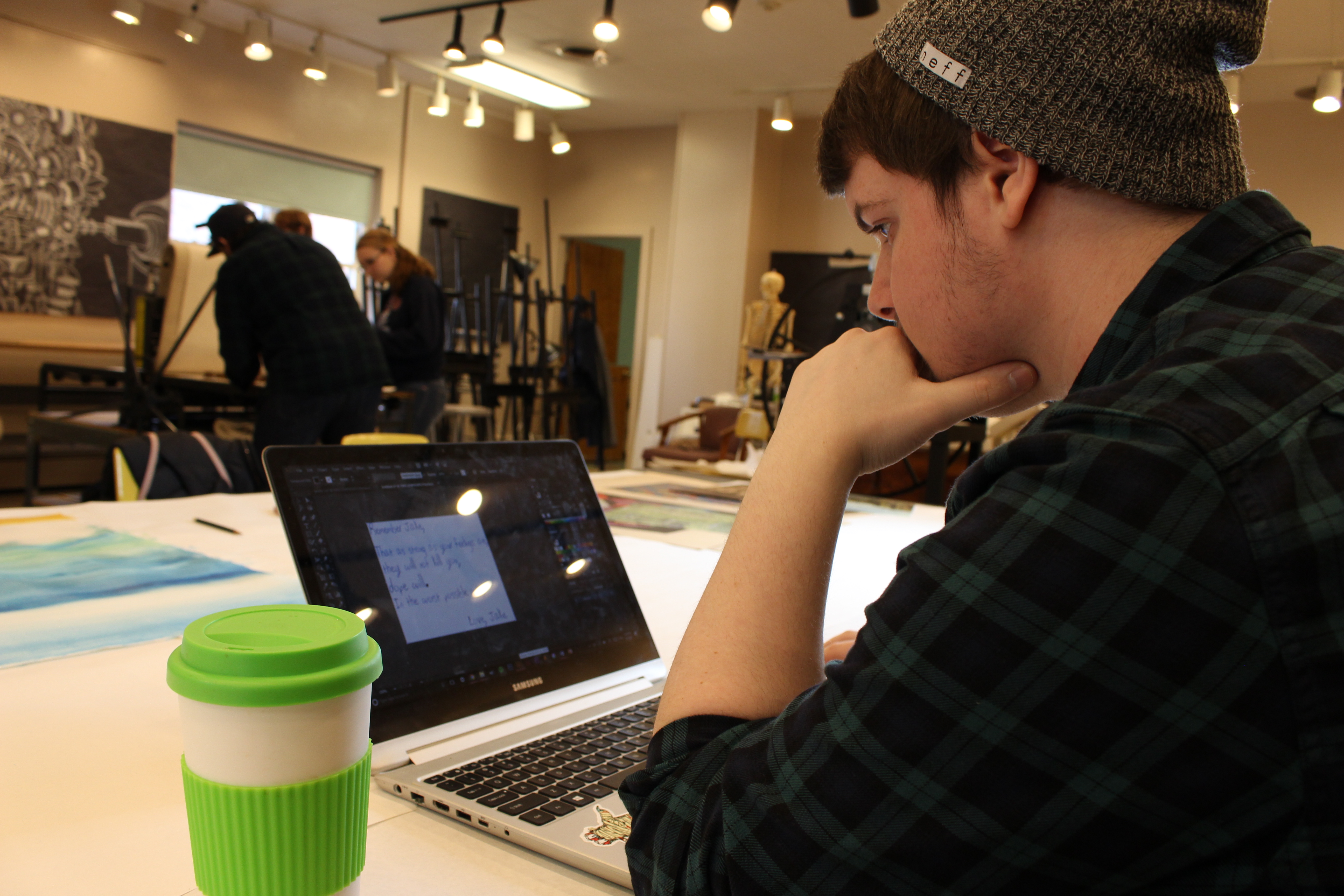 Dan looks at laptop